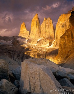 Chile, Patagonia, Torres del Paine NP, Dramatic clouds enhance a spectacular sunrise view of the Los Torres del Paine