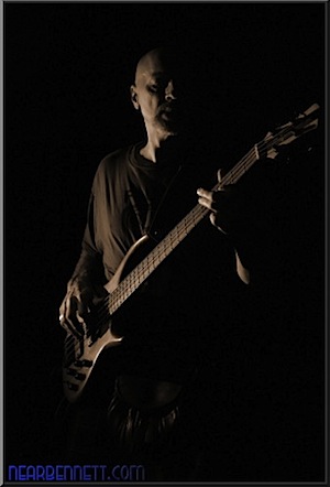Bass player lit with off camera flash