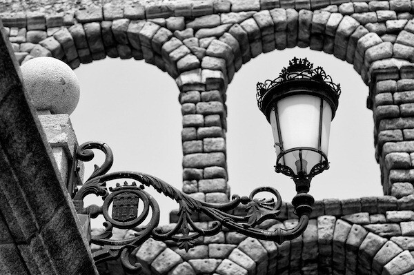 Lamp Framed in Acueducto Arch - Segovia, Spain - Copyright 2012 Ralph Velasco