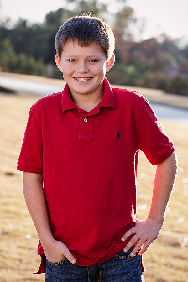 For guys, a little harshness in the light can be a good thing. So for this shot, I positioned the sun over his left shoulder, and a reflector to the right and in front of him. EOS-1D X, EF 85mm f/1.2L II. 1/320, f4, ISO 100.