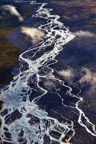 The McKinley River flows through the tundra of Denali.  The silt deposited by the river changes its direction and creates these little strands. This shot was taken at 11,000 feet up. 5D Mark II, Ef 24-105 f/4L IS at 105mm. 1/500 at f/8, ISO 400.