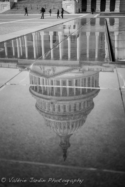 Photographing a reflection of a famous landmark such as the US Capitol in DC was a good way to avoid the cliché shot that every other tourist snaps daily. Adding the human element adds a sense of scale. 