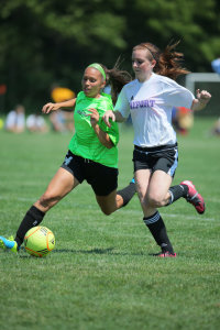 From behind the end line, you can often capture two players fighting for position on the ball. Canon EOS-1D X, EF 200-400 f/4L IS Extender 1.4x. 1/1000, f/5.6, ISO 400.