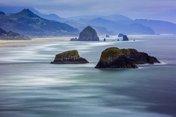 From Ecola State Park, you can view the vast expanse of Cannon Beach below.  EOS 5D Mark III, EF 70-300 f/4-5.6L IS, with a 5-stop and 6-stop ND filter stacked together to create the long exposure. 30 seconds, f/25, ISO 160.