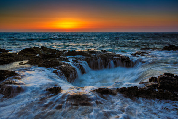 Thor's Well, at Cape Perpetua, is breathtaking in showcasing the ocean's power. EOS 5D Mark III, EF 24-70, f/2.8L II, at 31mm. 1/5, f/16, ISO 100.   Due to the spray I was unable to use a graduated neutral density filter, so in the raw processing I pulled the exposure for the sky back using a digital graduated filter in Adobe Camera RAW. 