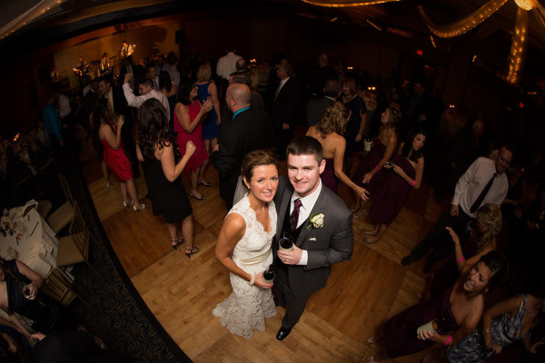 A fisheye lens has become a staple in my bag for shooting weddings. I've found it useful in the church for taking an overall scene, as well as on the dance floor for shots like this, of the bride and groom surrounded by their guests. Simply pop the flash at the same time and put them in the spotlight.