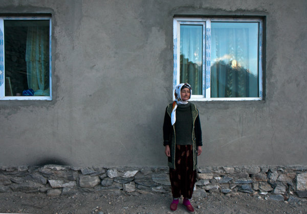-Tajikistan- Canon EFS 17-55mm f/2.8 Fstop of 5.6, shutter speed@1\100 and ISO 100 Natural light (sunrise) reflecting from the mountains, which are about 45 degrees to the woman (you can see it in the window).