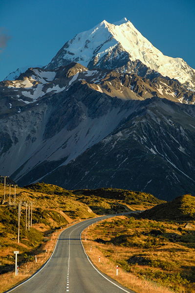 The road to Mount Cook New Zealand.  Nikon D7000, Nikkor 70-200mm f/2.8 Vrii, Marumi Polarizer. 135 mm (202mm 35mm equivalent), f/11, 1/15h, ISO100. The vertical aspect exaggerates the effects of telephoto compression in scenes like this.