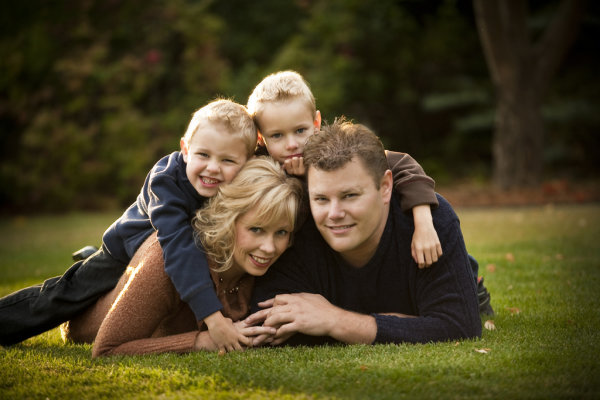 The lying in the grass, pile on top pose. Great for families with small children.