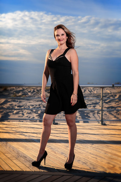 This was one of the first shots taken, on the boardwalk at the beach. The sun was harsher than I wanted so opted to use wireless flash. I positioned my friend with the sun at her back and over her right shoulder, and the flash to her front left. I also had the flash set to high speed sync. I then set the flash to E-TTL, with flash exposure compensation set to even. I set the camera's exposure compensation to -1, in Aperture Priority. Doing this lessens the sun's impact on the image, helps darken the sky, and the background overall. Exposure was ISO 100, f/4, 1/4000.