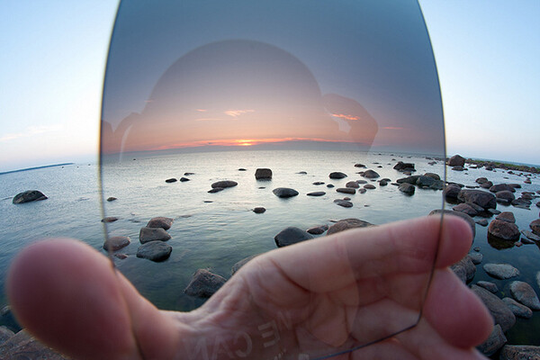 A wide view of a hand-held graduated neutral density filter illustrates how valuable it is to capturing accurate colors in landscape photography.