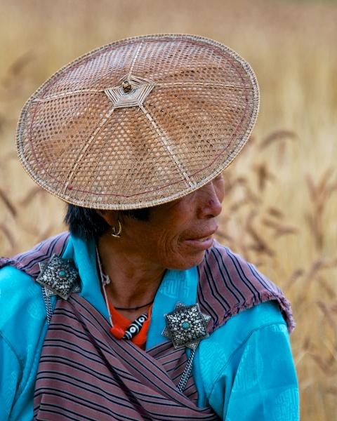 Travel Photography Tips - Native Clothing - Woman in Kira in Wheat Field  P  Bumthang Valley Bhutan  Copyright 2013 Ralph Velasco
