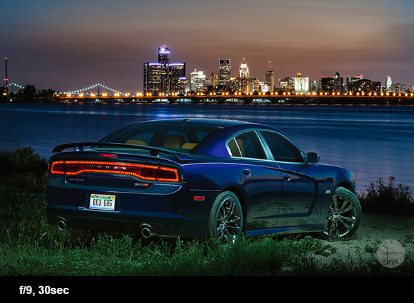 Dodge Charger with the skyline of Detroit City