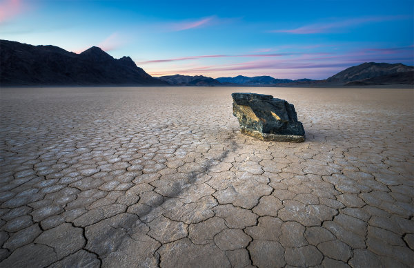 A mysterious sailing rock during sunset at the Racetrack Playa