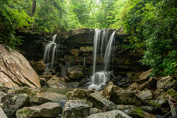 This image was created from three files using Exposure blending. Exposure #1 was exposed for the light green area above the falls and exposure #2 was exposed for the shadow area below the falls. The light was hitting the rock on the left  very hard so a third exposure was need just for that rock.