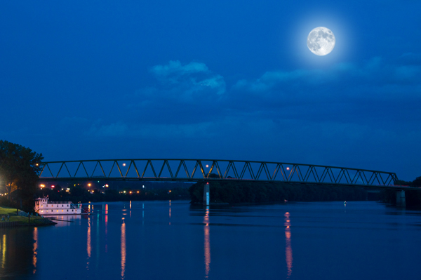 Two exposures were combined to make this final image. One image was exposed for the landscape and the other for the moon. The moon was enlarged slightly for dramatic effect.  