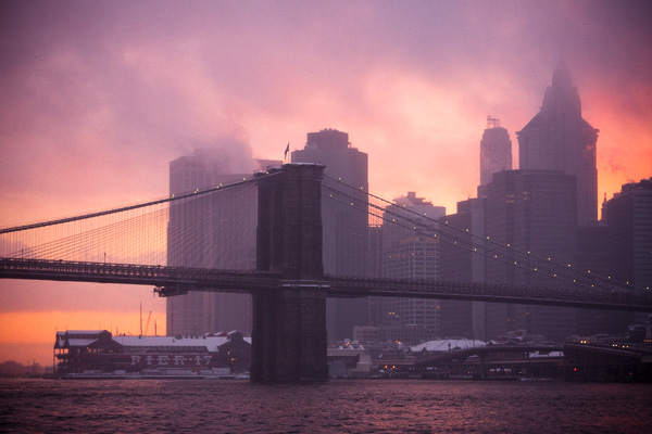 Brooklyn Bridge in Snowstorm, at Sunset