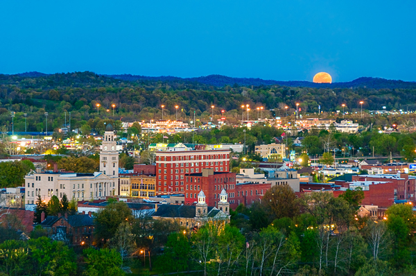 Here the April moon called the "Pink Moon" rose over Marietta, Ohio. The setting sun lit the city in a warm glow.