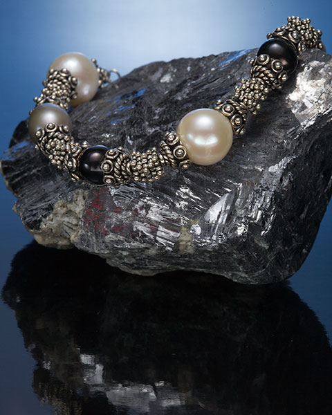 jewelry product shot using a gelled strobe and light panel