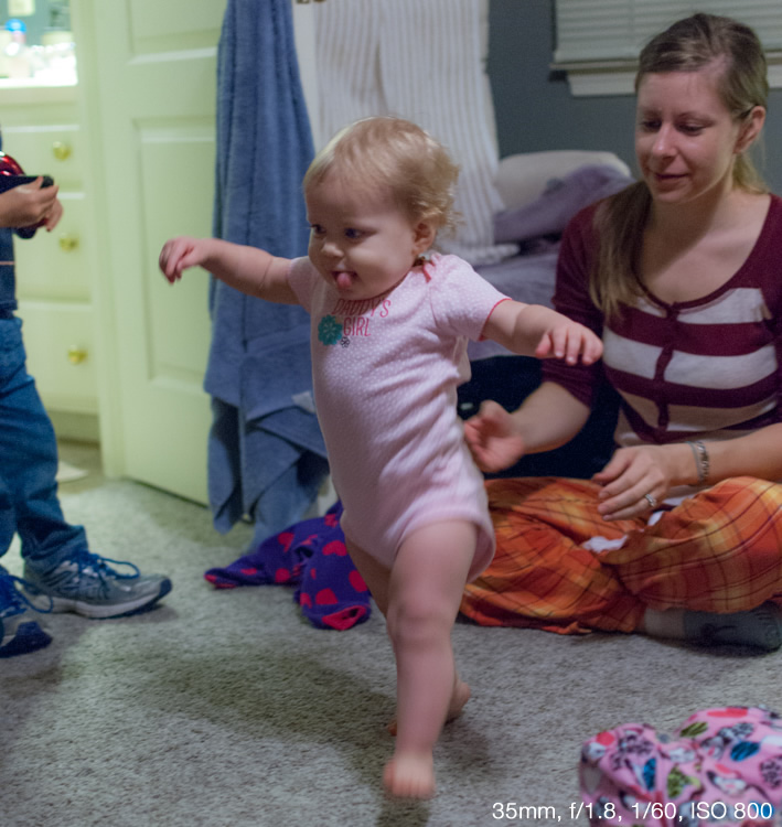 Shooting at an ultra-wide aperture of f/1.8 allowed me to get a picture of this girl taking her first steps. Using the flash would have resulted in washed-out colors and would have been quite a distraction for the little girl.