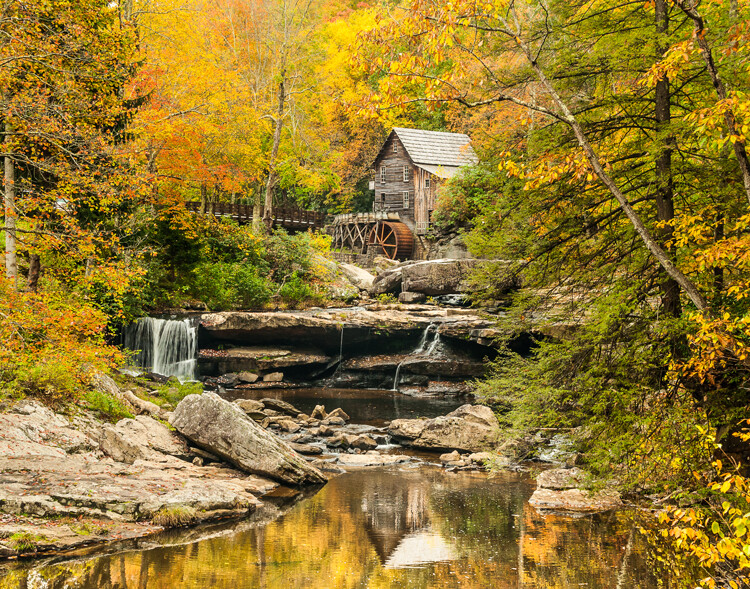 Here Manual mode was used to control the DOF and to use a slow shutter speed to blur the waterfalls.