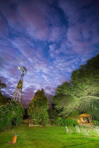 A windmill stands in the garden of the Finca Santa Anita in Salta Province, Argentina.