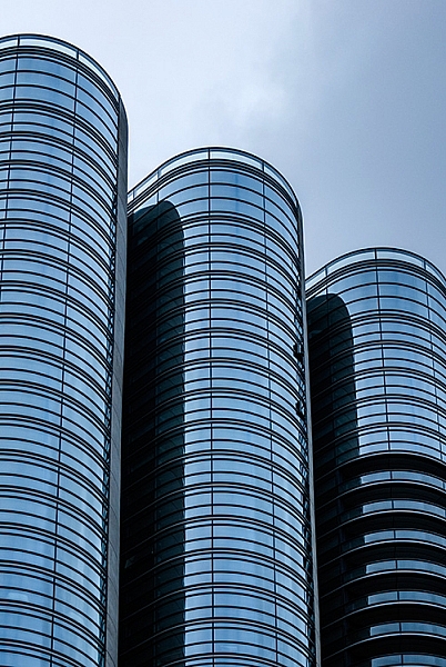 The curved shapes of the glass buildings gives a great sense of rhythm
