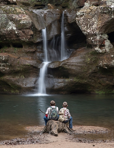 Choosing a smaller aperture of f/22 gave enough depth of field to keep both the boys and the waterfalls in focus.