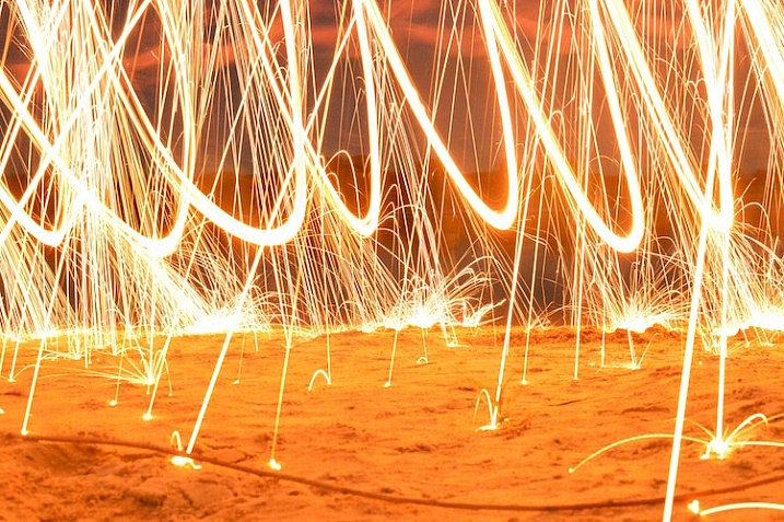 fire-spinning-beach-sparks