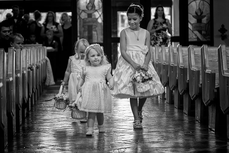 24-120mm. Shot at 120mm, 1/160, f/4, ISO 1400. Knowing how the lens behaves at both ends of the zoom, I knew I could use this lens for wide angle shots in close, but zoom in as the flower girl was coming down the aisle and still get an interesting shot.