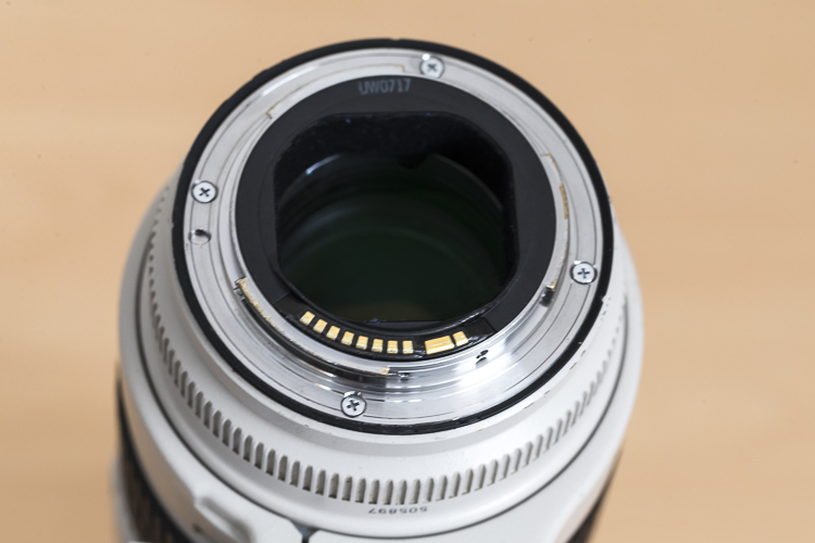 With this lens the rear elements sits deeper in the lens barrel.