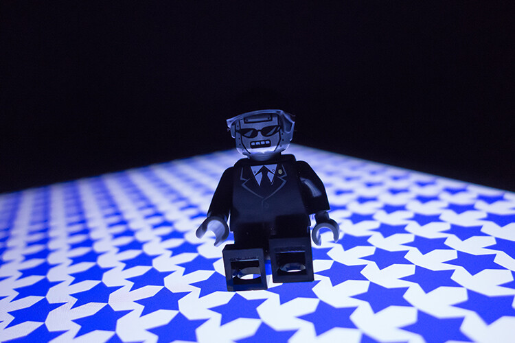 lego-figure-blue-stars-background