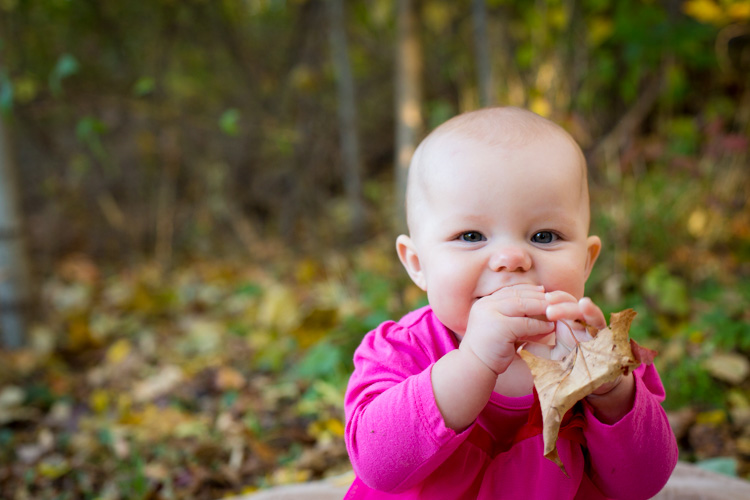 We let her play with the leaves on the ground. The smile is so mischievous because she knew she wasn't supposed to put the leaf in her mouth. 