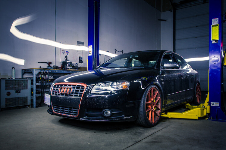 A light painted car where the light source is visible