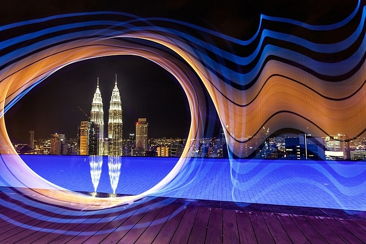 The petronas towers in Kuala Lumpur are framed using light from the pixelstick, adding a lot of interest to this photo.