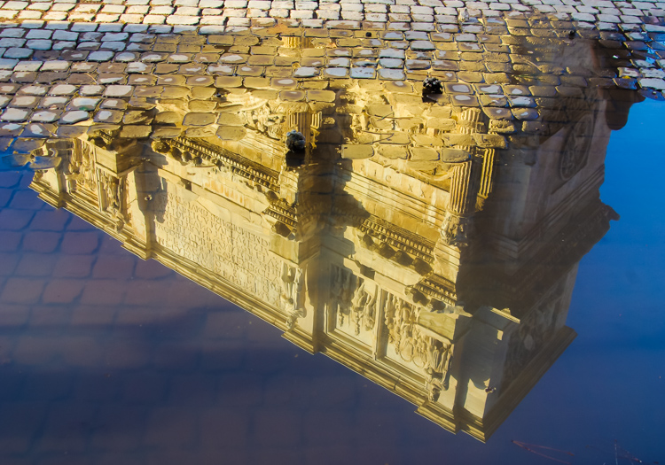 Rome - reflection of building in a puddle