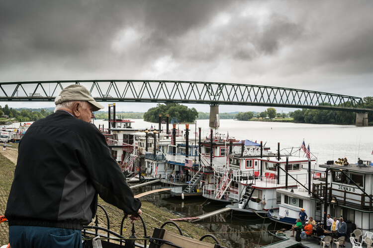 This image seems to tell the story of a man thinking about the yester-years working on a river boat.