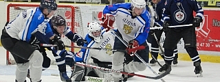 An sports action shot of hockey players fighting for the puck
